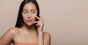 a lady using skincare product