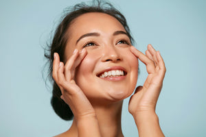 smiling on face with organic facial moisturizer