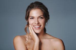 smiling face with organic skin care products